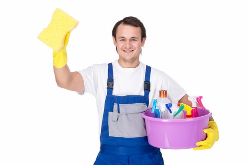 Carpet cleaning technician preparing equipment for a booked service