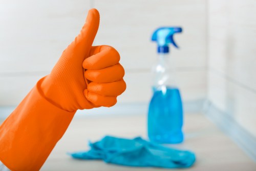 Cleaner using protective equipment while handling cleaning products